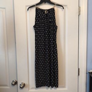 Sleeveless black dress with “gold chain” straps